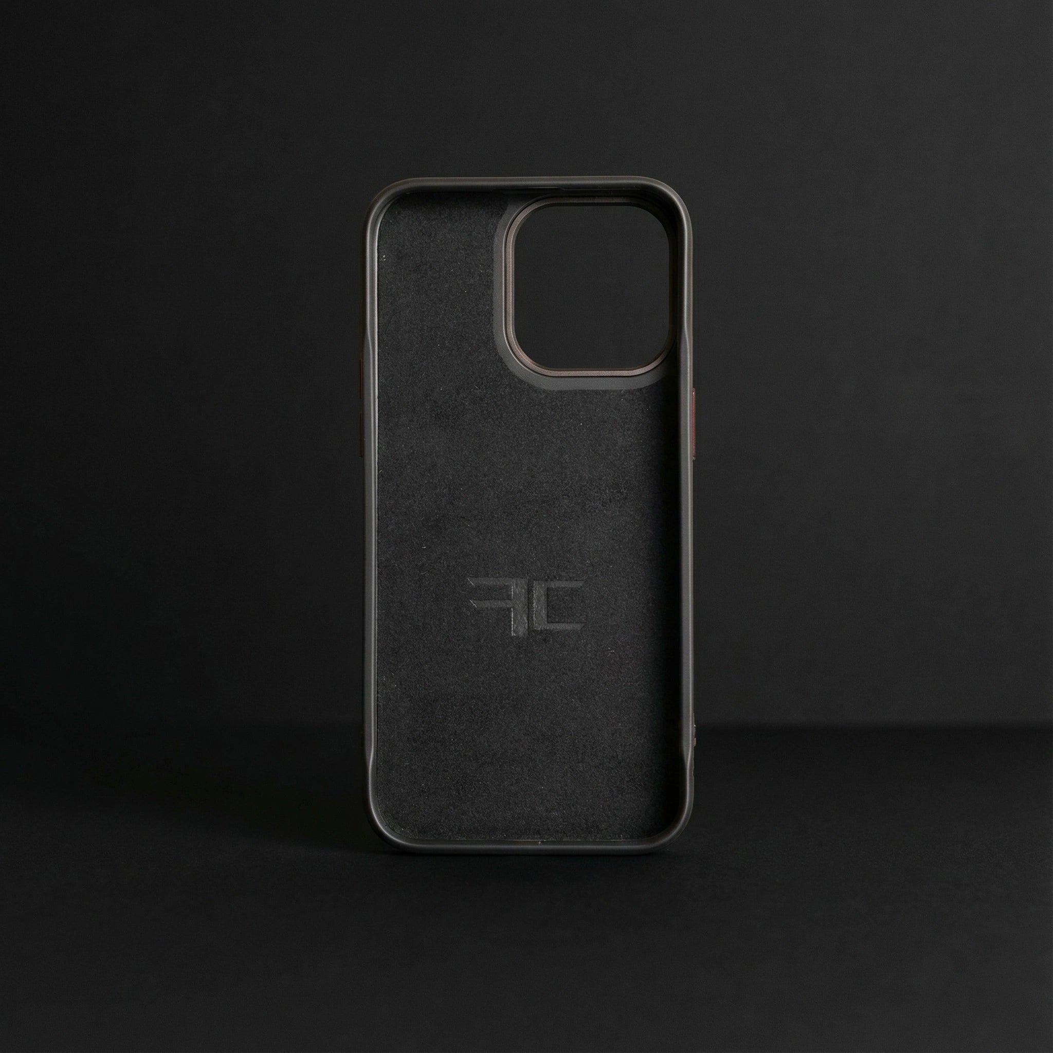 carbon fiber phone case with a microfiber inside soft touch lining on a dark background