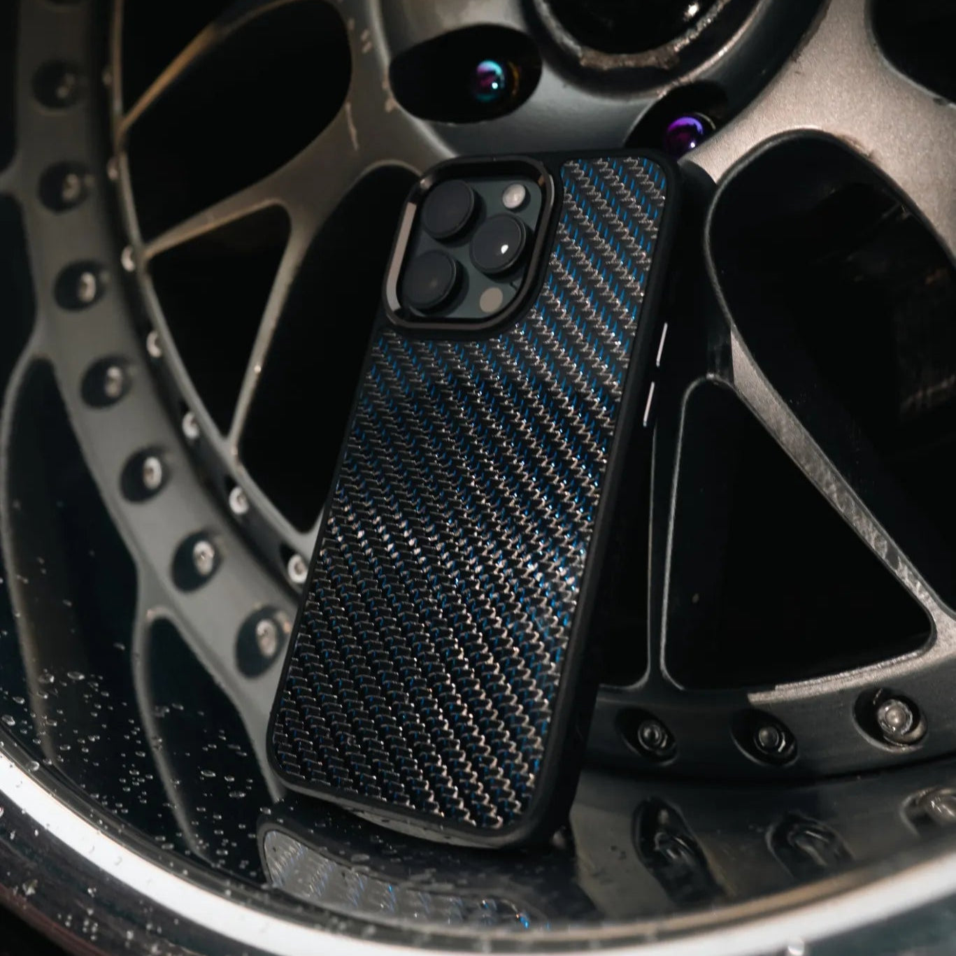 Carbon fiber phone case on Nissan JDM rims