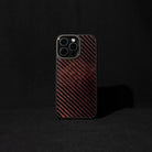 Red carbon fiber phone case on a black background

